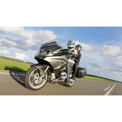 two person riding BMW motorcycle with Pilot Road 4 Tire installed
