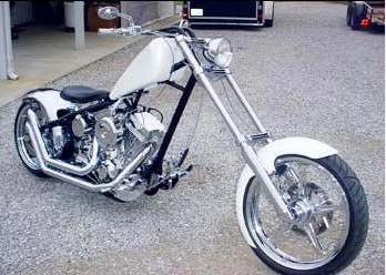 Outlaw front and rear wheel shown on motorcycle chrome finish, angled view